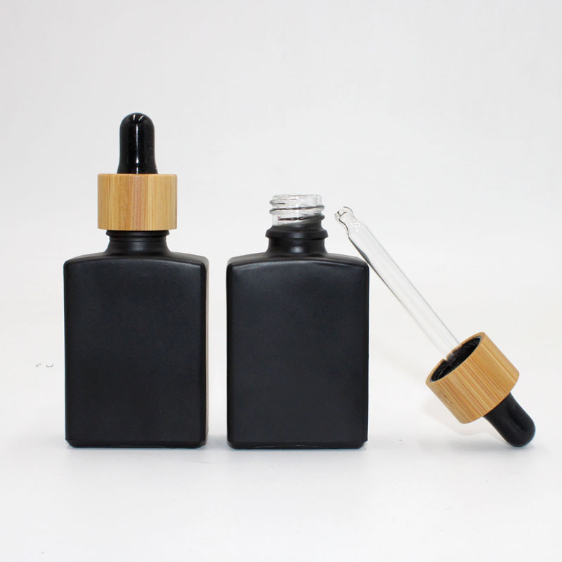 Wholesale Square Glass Essential Oil Tincture Bottles with Bamboo Dropper 1 OZ Black Rectangle Cheap Price For Sale